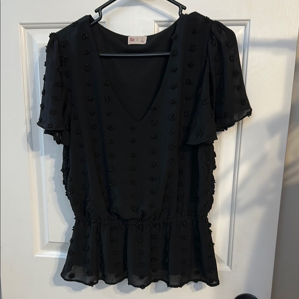 So fuzzy detail peplum top in black. Size large.